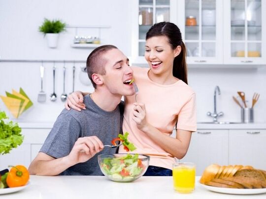 a woman feeds a man products to increase potency naturally