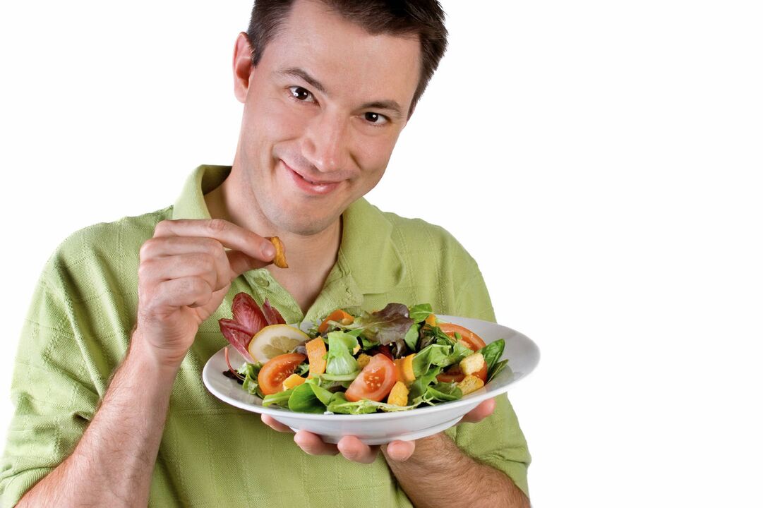 man eating vegetable salad for effect